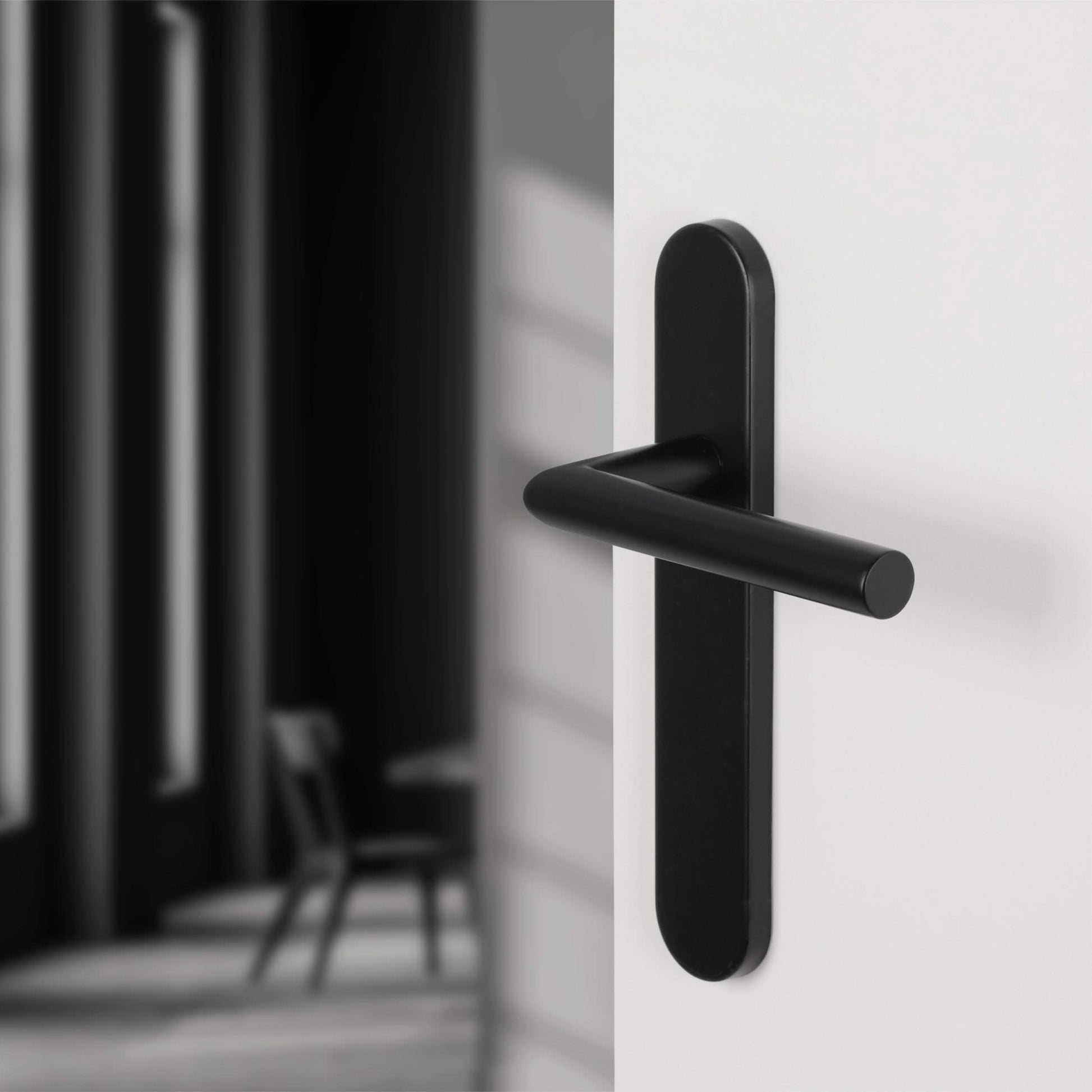 Differnz | Amsterdam deurkruk | ovaal schild | blind | zwart - Deurbeslag-expert