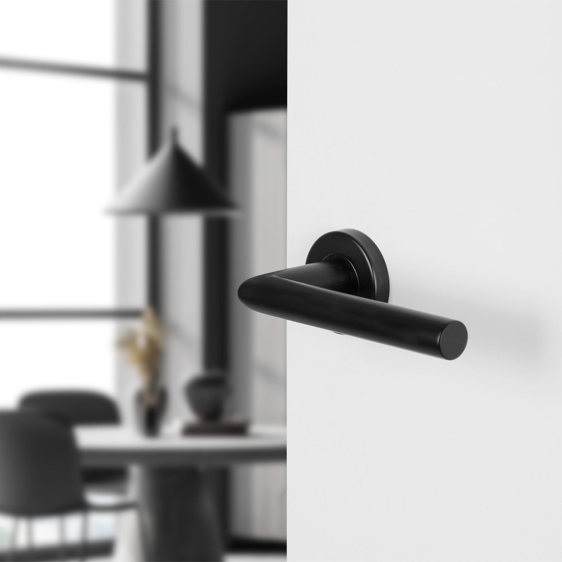 Differnz | Amsterdam deurkruk | rond rozet | zwart - Deurbeslag-expert