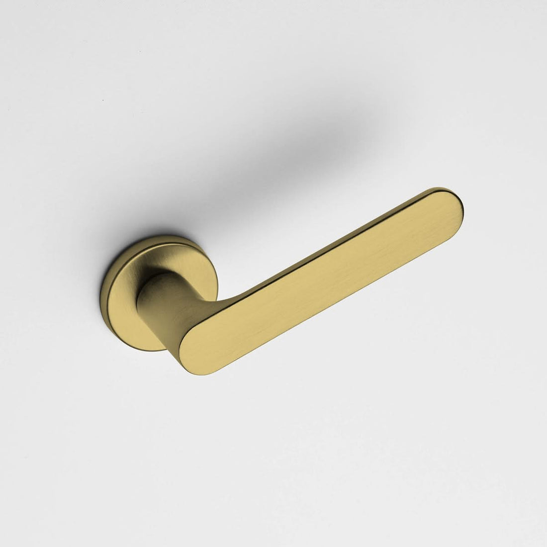DND deurkruk Spot in Satin Gold gemonteerd op een binnendeur – sfeerbeeld