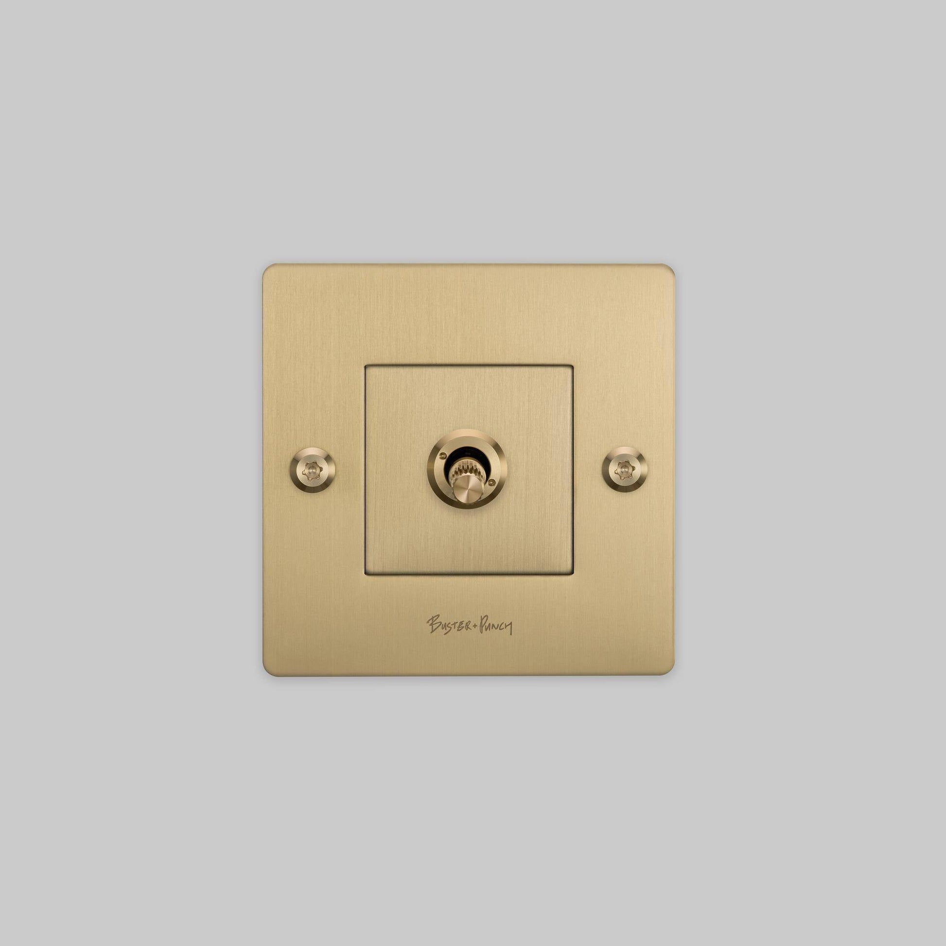 buster + punch | lichtschakelaar 1-voudige tuimelschakelaar linear (met logo) | goud zijaanzicht