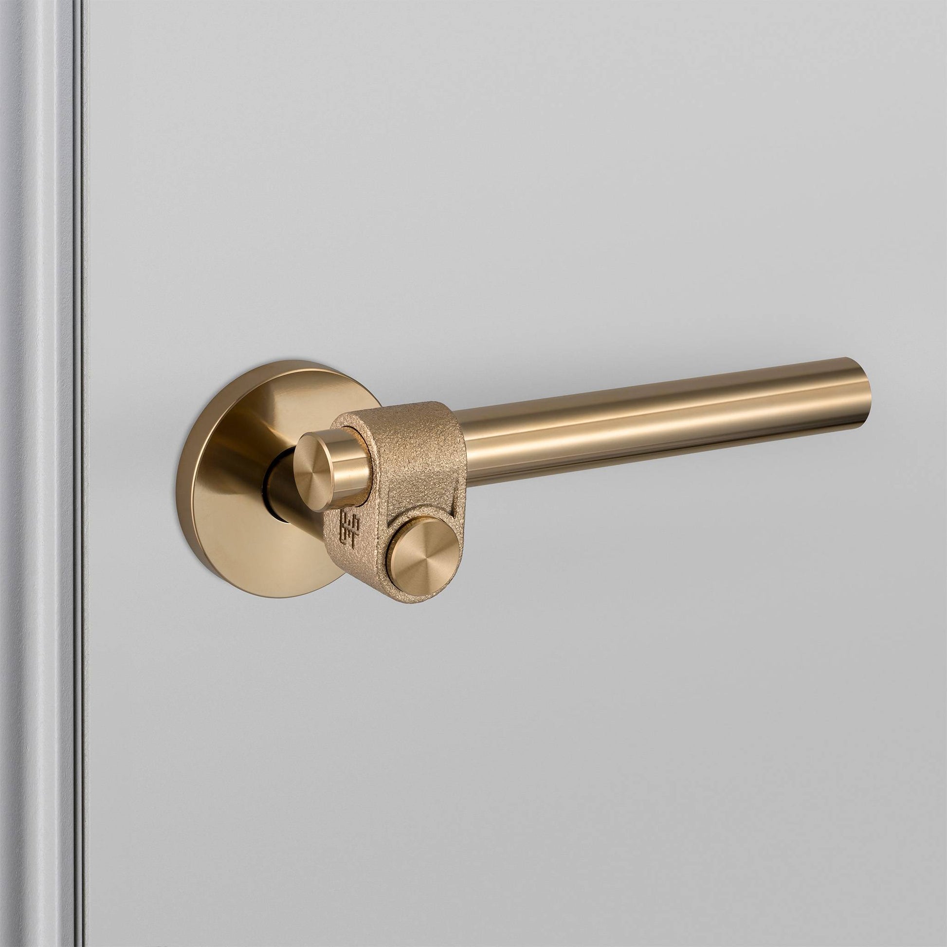 buster + punch cast | deurkruk op rozet | brass