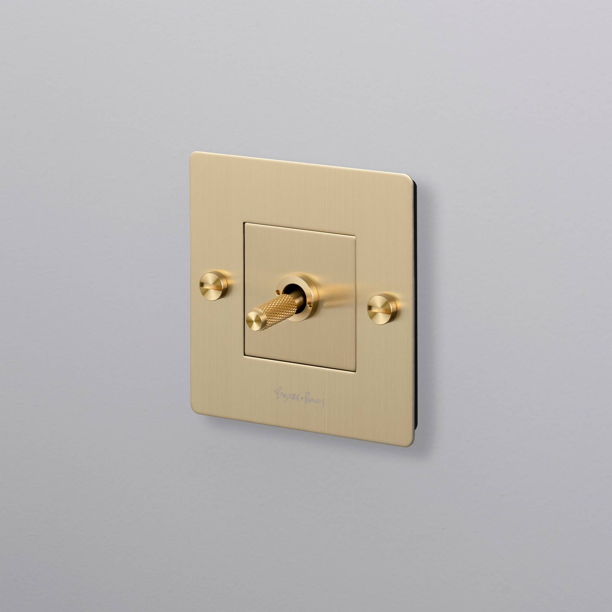 buster + punch | lichtschakelaar 1-voudige tuimelschakelaar cross (met logo) | goud