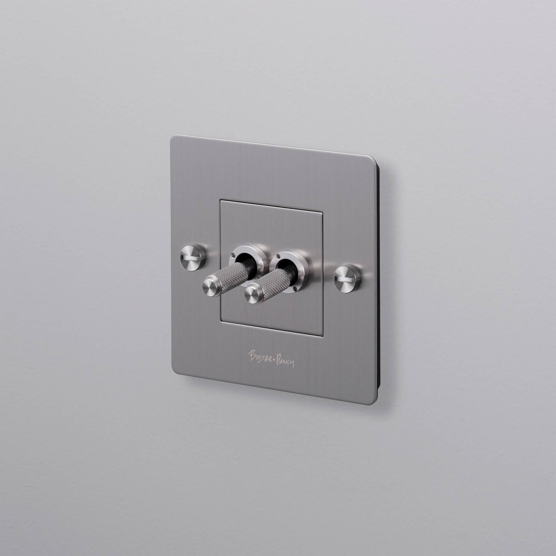 buster + punch | lichtschakelaar 1-voudig dubbele tuimelschakelaar (met logo) | steel
