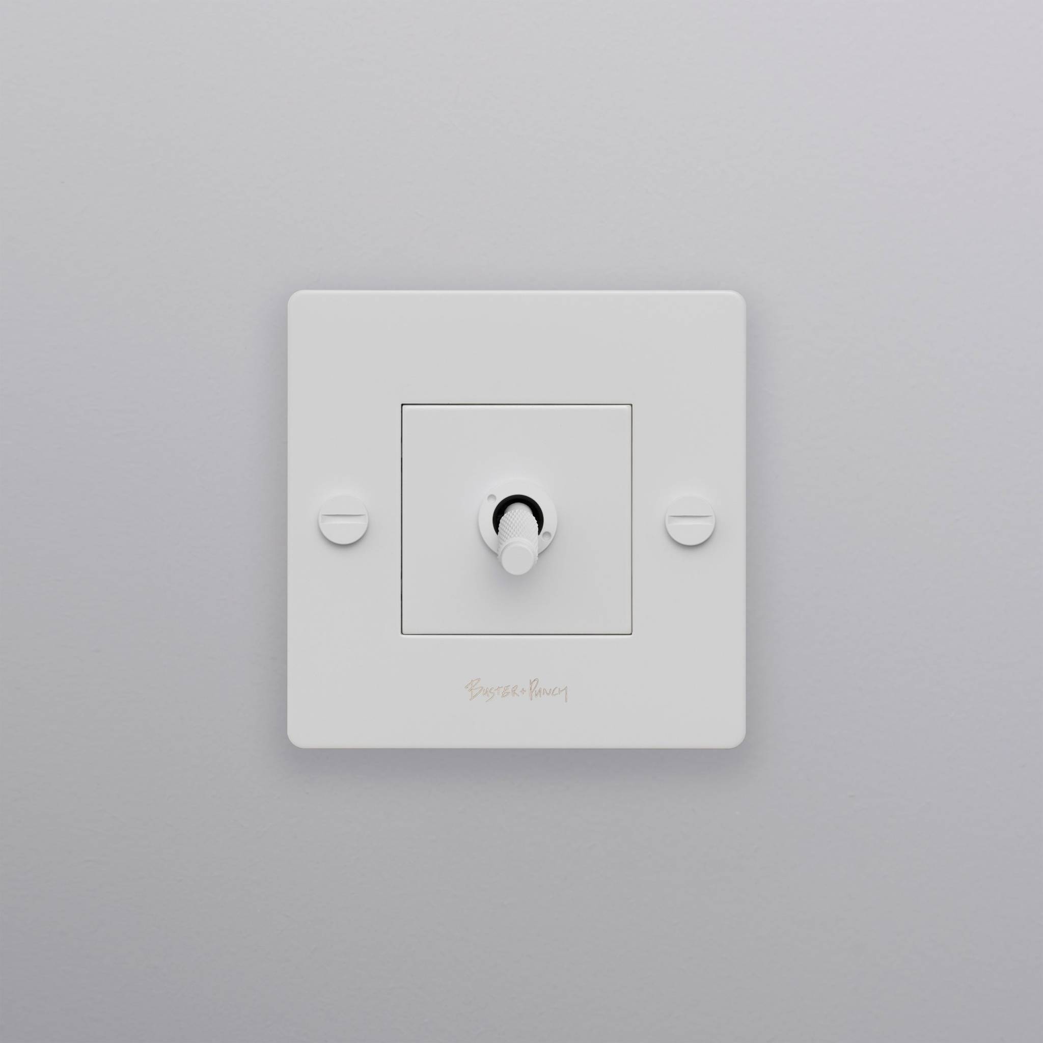 buster + punch | lichtschakelaar 1-voudige tuimelschakelaar cross (met logo) | white zijaanzicht