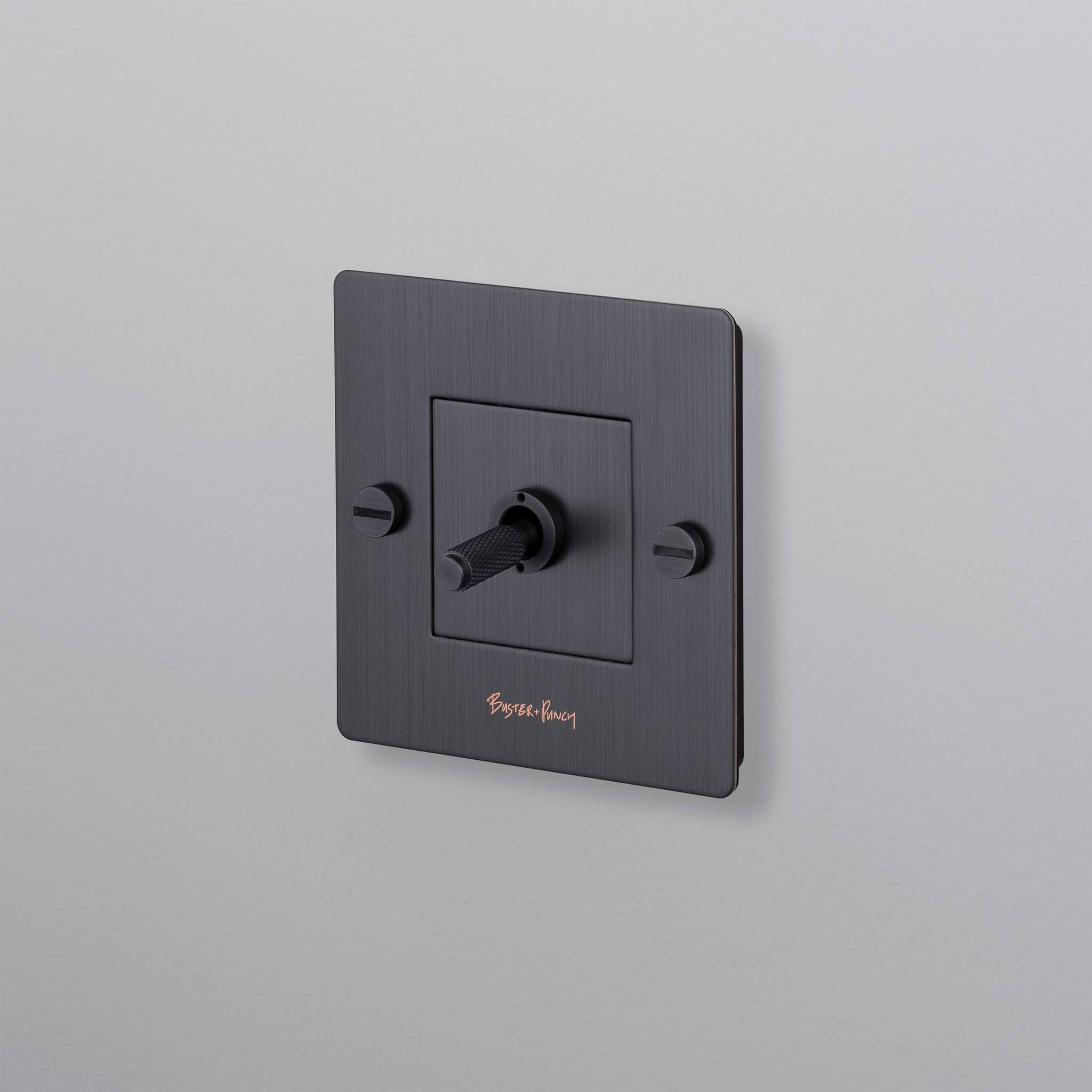 buster + punch | lichtschakelaar 1-voudige tuimelschakelaar cross (met logo) | smoked bronze