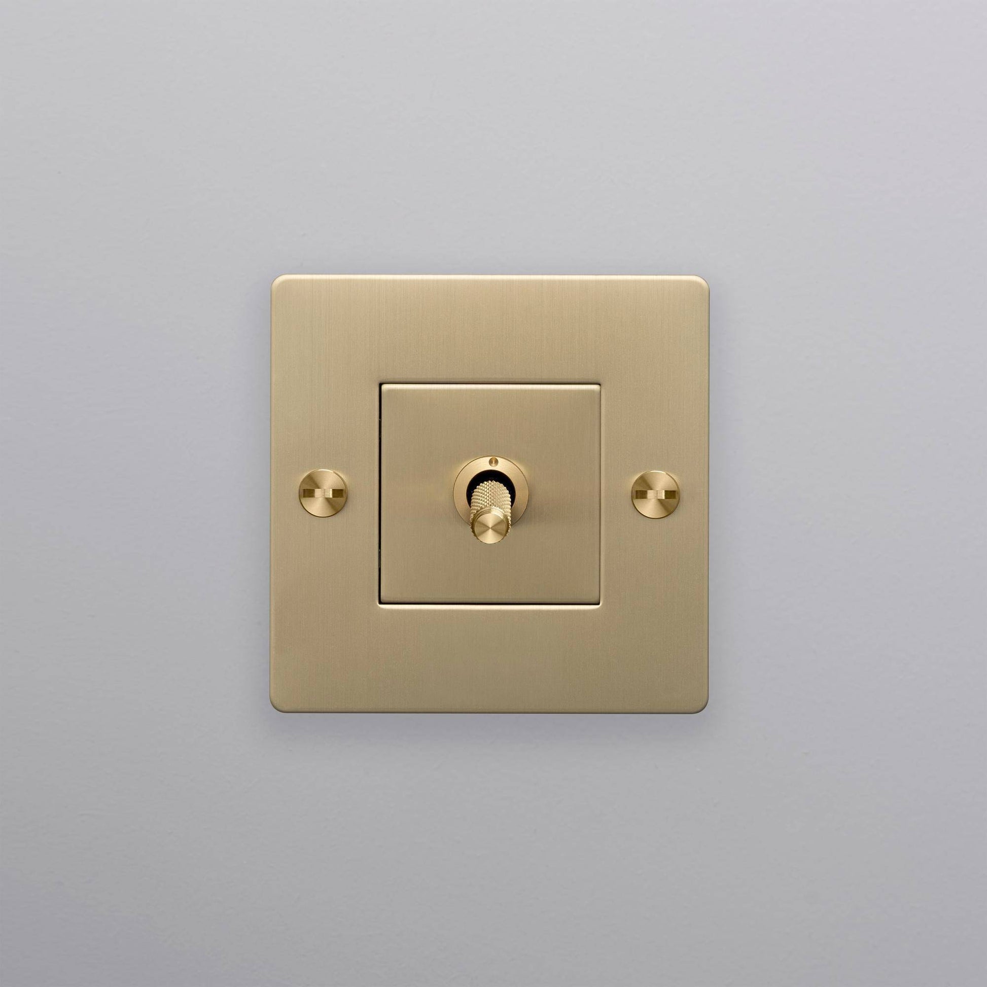 buster + punch | lichtschakelaar 1-voudige tuimelschakelaar cross (zonder logo) | goud zijaanzicht