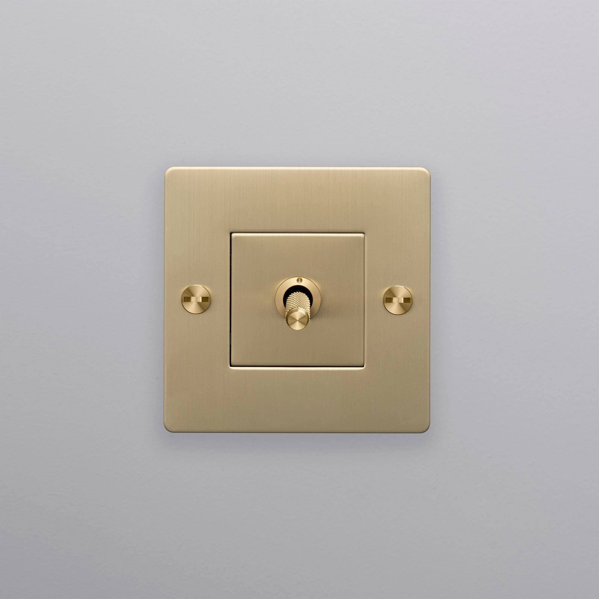 buster + punch | lichtschakelaar 1-voudige tuimelschakelaar cross (zonder logo) | goud zijaanzicht