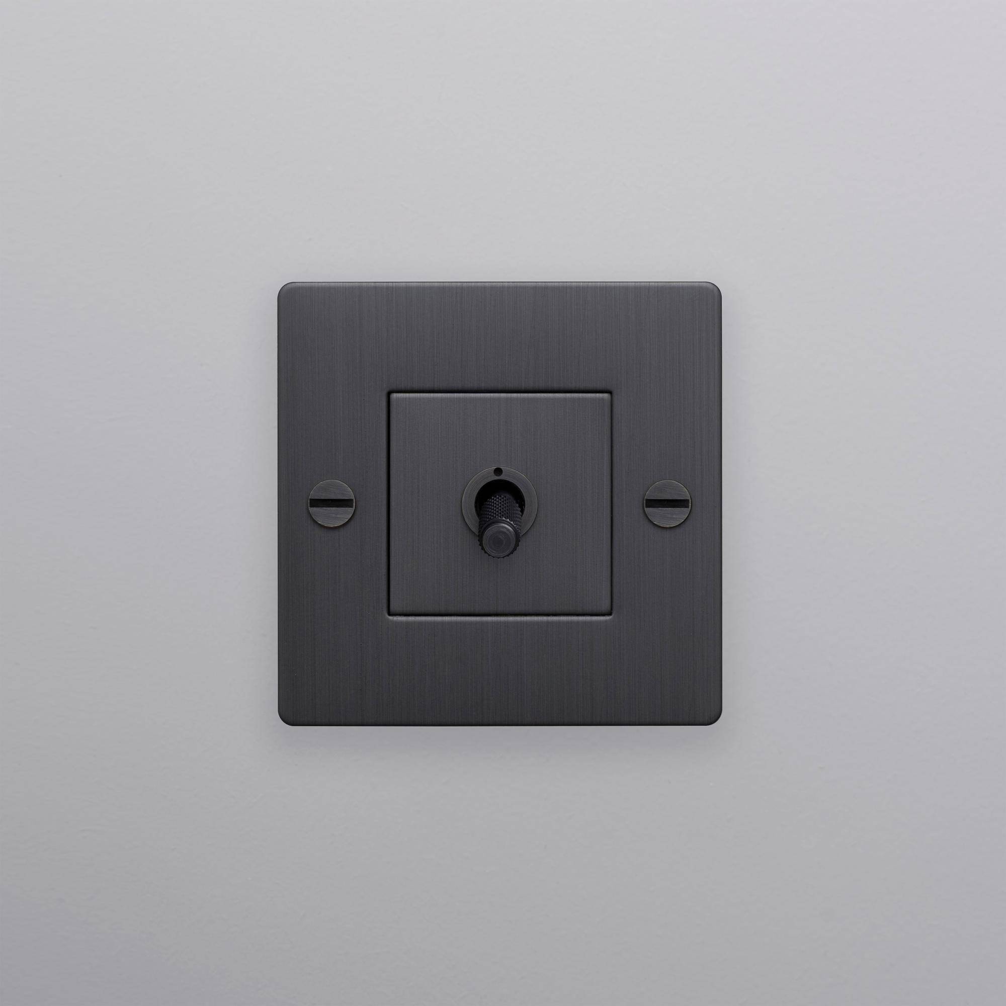 buster + punch | lichtschakelaar 1-voudige tuimelschakelaar cross (zonder logo) | smoked bronze zijaanzicht