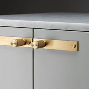 buster + punch cross | meubelknop op rozet | goud