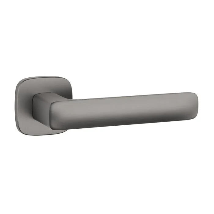 Door handle on a rounded rosette in the color graphite of the Aprile brand